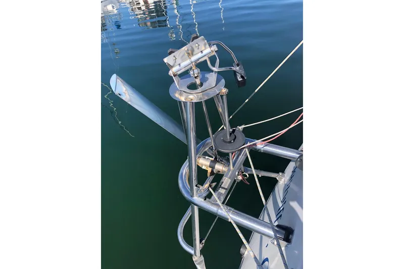 Slide: The Image of Sailboat wind vane steering system on a 1988 Freedom 36, docked on calm water. - 5