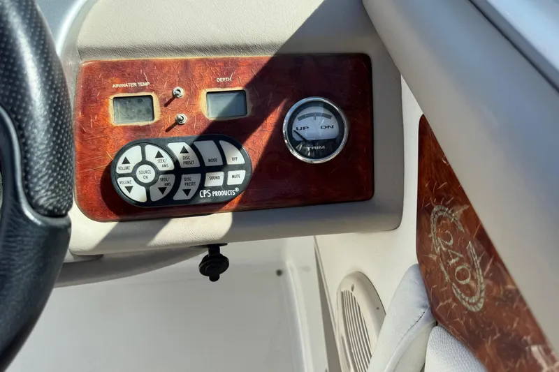 Slide: The Image of Control panel of a 2005 Cobalt 240 boat with temperature and depth gauges. - 17