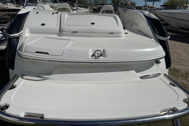 Slide: The Image of 2005 Cobalt 240 boat stern view with swim platform and seating area. - 2