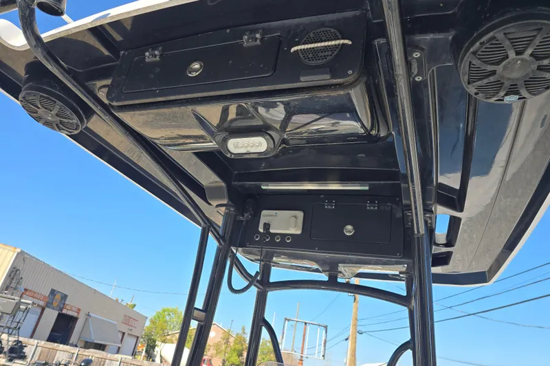 Slide: The Image of 2021 Blue Wave 2400 PureBay boat console with speakers and storage compartments. - 15