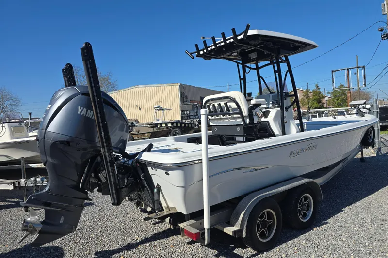 Slide: The Image of 2021 Blue Wave 2400 PureBay boat with Yamaha engine on trailer, parked outdoors. - 5