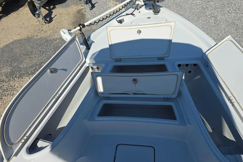 Slide: The Image of Open storage compartments on a 2021 Blue Wave 2400 PureBay boat deck. - 9