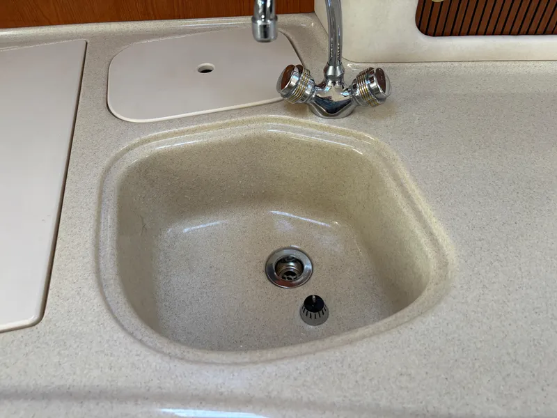 Slide: The Image of Sink and faucet in 1999 Sea Ray 340 Sundancer boat kitchen area. - 28
