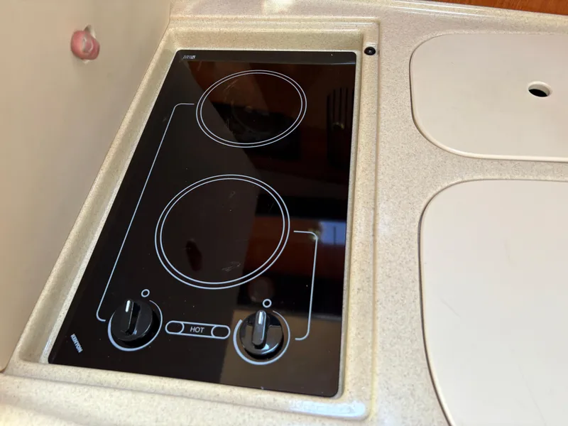 Slide: The Image of Built-in stovetop on 1999 Sea Ray 340 Sundancer yacht. - 29