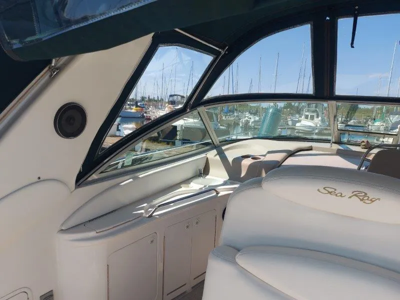 Slide: The Image of Interior view of 1999 Sea Ray 340 Sundancer yacht at marina. - 31
