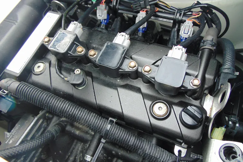 Slide: The Image of Engine of 2022 Yamaha WaveRunner VX Deluxe, showcasing intricate components and wiring. - 12