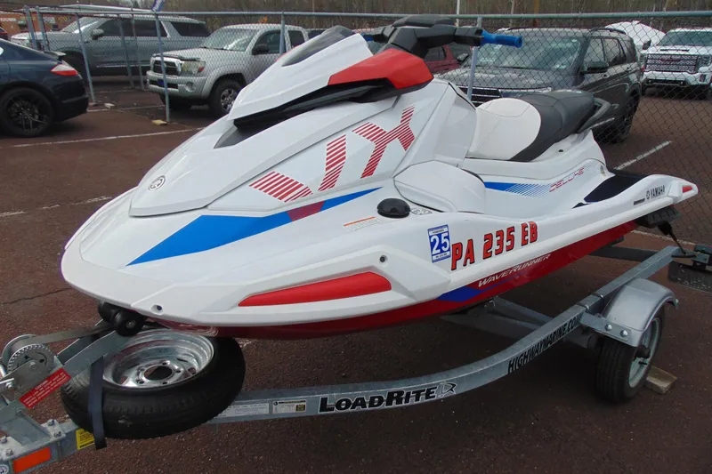 Slide: The Image of 2022 Yamaha WaveRunner VX Deluxe on trailer, parked in lot. - 3