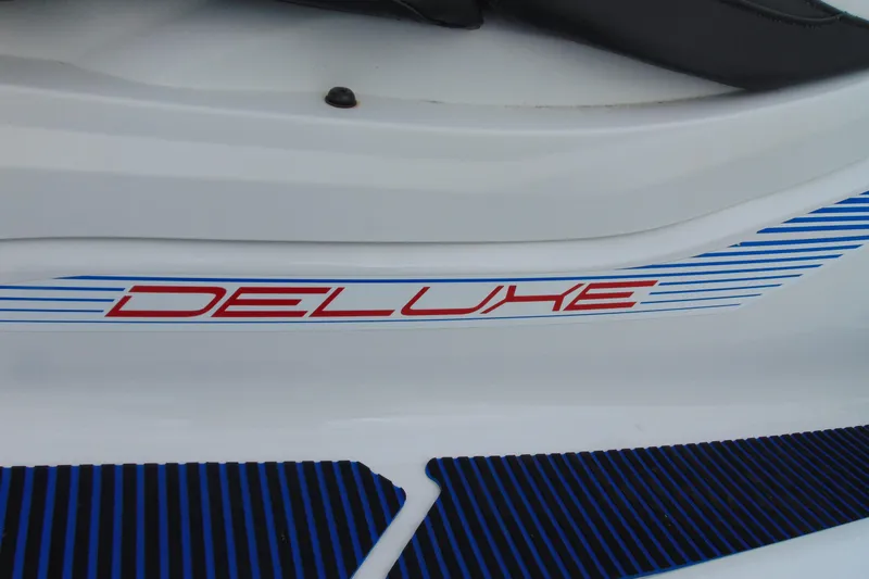 Slide: The Image of 2022 Yamaha WaveRunner VX Deluxe, close-up of "Deluxe" decal on white body. - 9