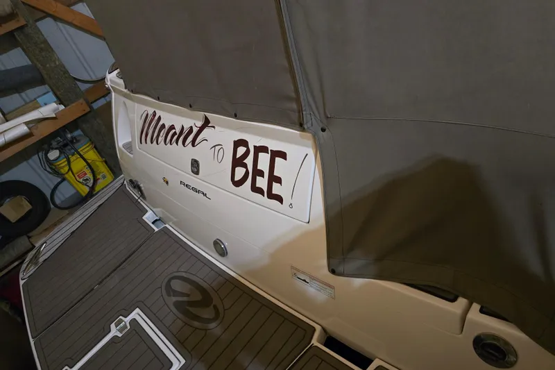Slide: The Image of 2008 Regal 3060 Window Express boat with "Meant to Bee" text on the stern. - 11
