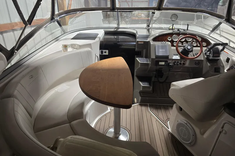 Slide: The Image of Interior of a 2008 Regal 3060 Window Express boat with seating and helm. - 12
