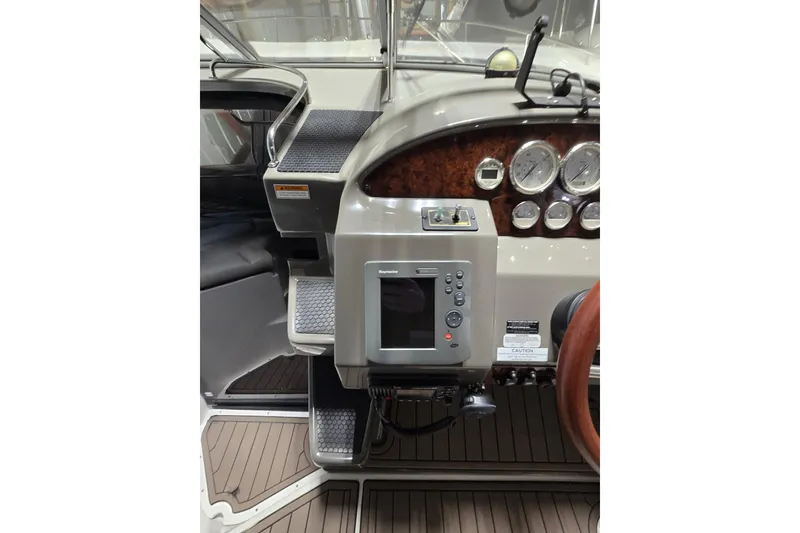 Slide: The Image of 2008 Regal 3060 Window Express boat dashboard with gauges and navigation system. - 15