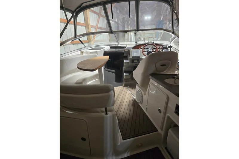 Slide: The Image of Interior of a 2008 Regal 3060 Window Express boat with seating and helm. - 16