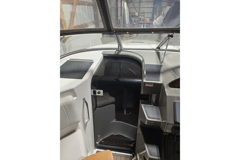 Slide: The Image of 2008 Regal 3060 Window Express boat interior with steps and dashboard view. - 19