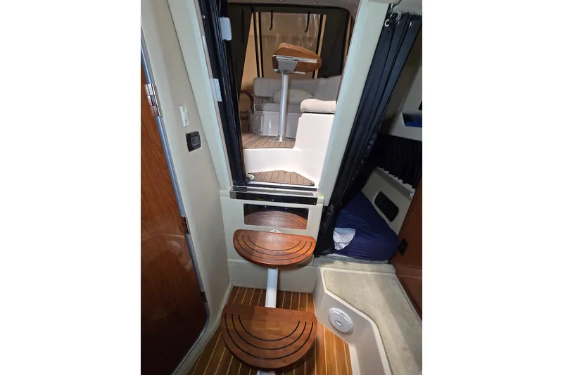 Slide: The Image of Interior view of 2008 Regal 3060 Window Express boat cabin with wooden steps. - 21