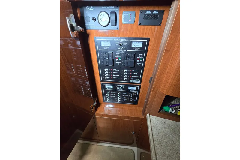 Slide: The Image of Control panel of a 2008 Regal 3060 Window Express boat interior. - 25