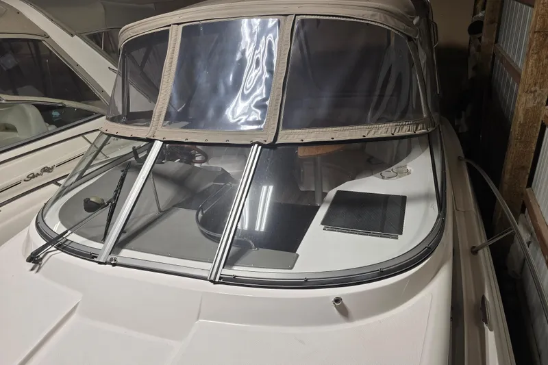 Slide: The Image of 2008 Regal 3060 Window Express boat with covered cockpit in storage. - 9