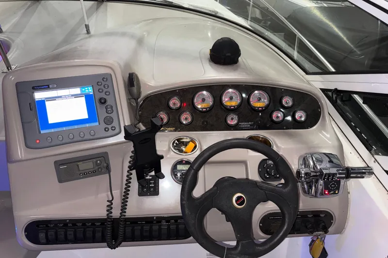 Slide: The Image of Dashboard of a 2004 Cruisers Yachts 340 Express with navigation and control instruments. - 27