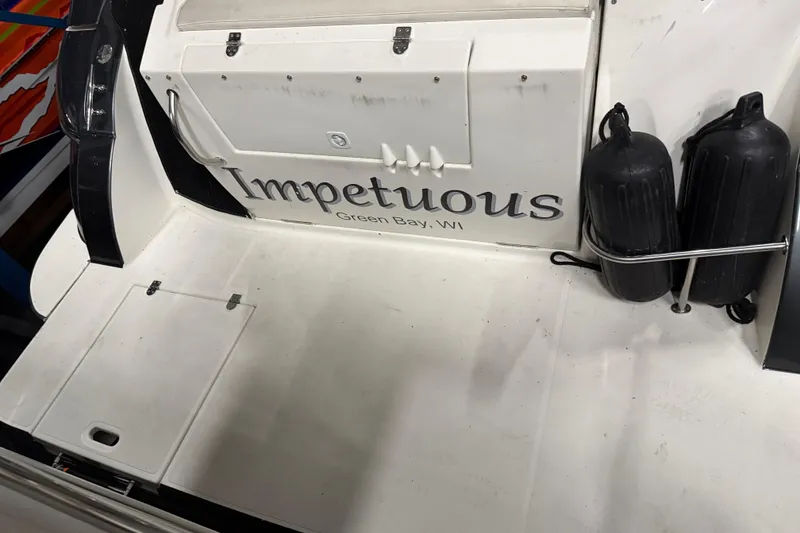 Slide: The Image of 2004 Cruisers Yachts 340 Express boat stern with "Impetuous" name, Green Bay, WI. - 45