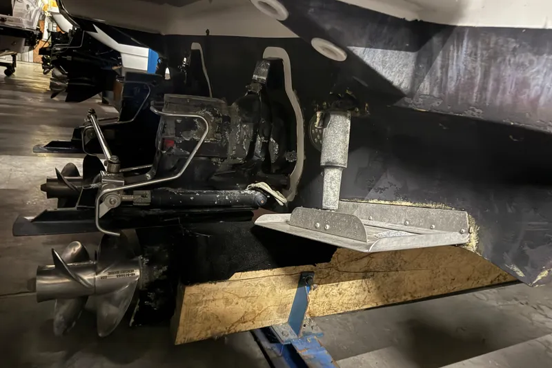 Slide: The Image of 2004 Cruisers Yachts 340 Express boat propeller and stern drive in a workshop. - 46