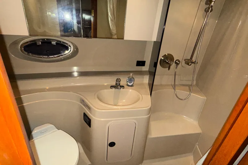 Slide: The Image of Bathroom interior of 2004 Cruisers Yachts 340 Express with shower and sink. - 6