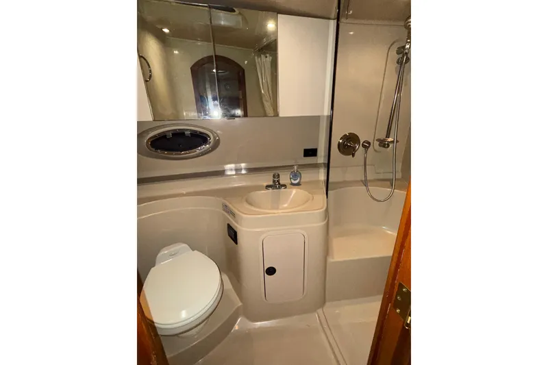 Slide: The Image of Bathroom interior of 2004 Cruisers Yachts 340 Express with shower and sink. - 7