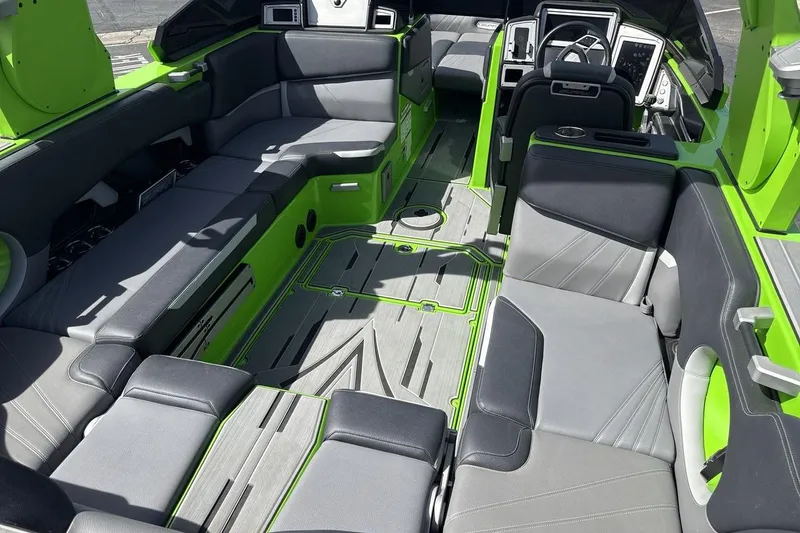 Slide: The Image of 2022 Supra SA 450 boat interior with green and gray seating, modern design. - 10