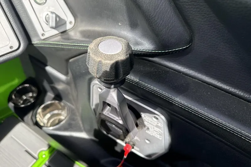 Slide: The Image of 2022 Supra SA 450 interior detail with gear lever and cup holder. - 16