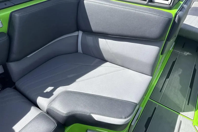 Slide: The Image of Gray and green interior seating of 2022 Supra SA 450 boat. - 17