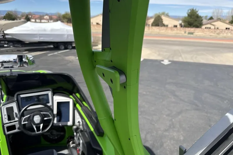 Slide: The Image of Interior view of a 2022 Supra SA 450 boat, showcasing steering and dashboard. - 26