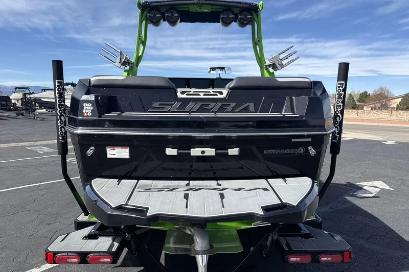 Slide: The Image of Rear view of a 2022 Supra SA 450 boat with swim platform and wakeboard tower. - 4