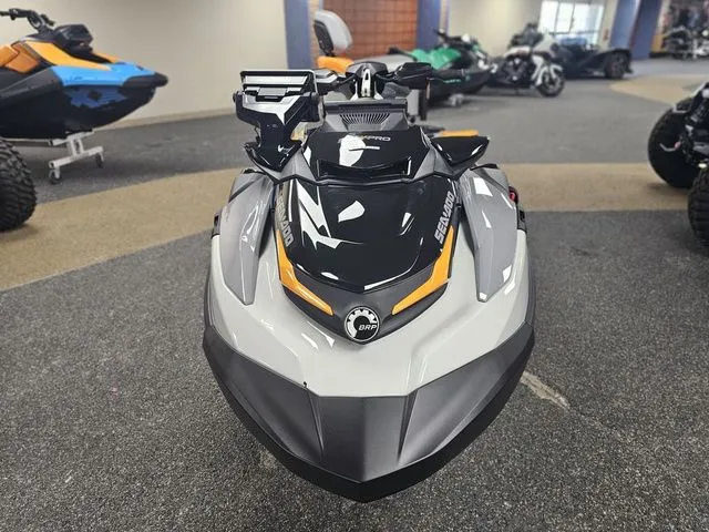 Slide: The Image of 2026 Sea-Doo FISH PRO jet ski in a showroom. - 2