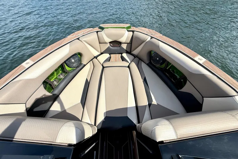 Slide: The Image of Luxurious seating on 2021 Centurion Ri245 boat, overlooking calm water. - 23