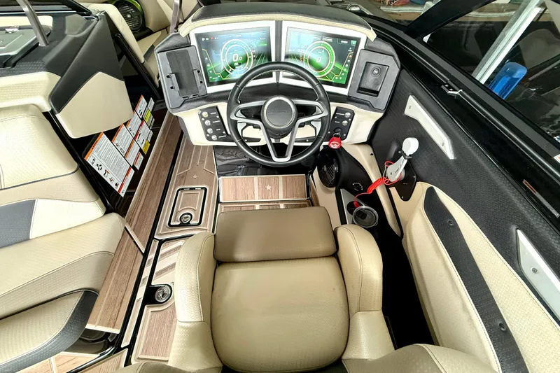 Slide: The Image of 2021 Centurion Ri245 boat cockpit with modern dashboard and steering wheel. - 28