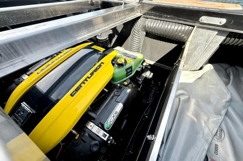 Slide: The Image of 2021 Centurion Ri245 engine compartment with yellow cover and visible components. - 30