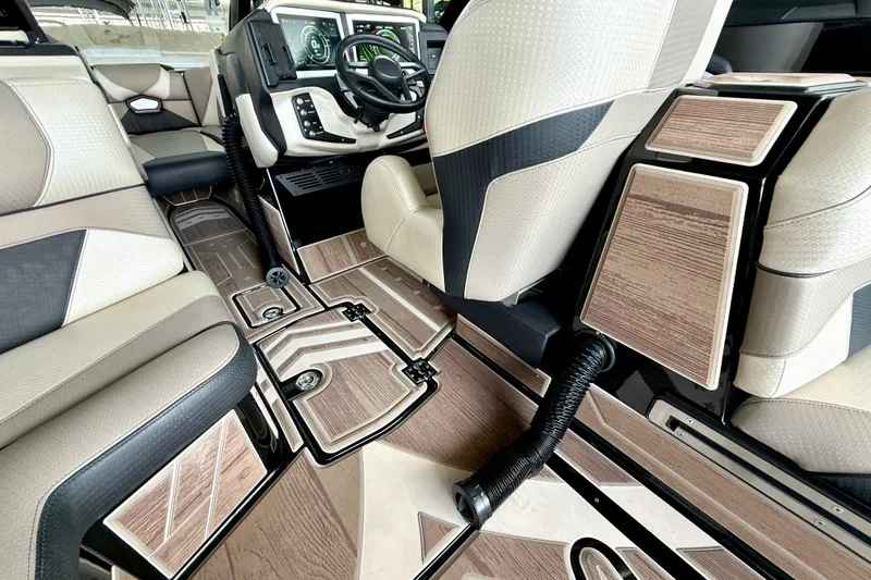 Slide: The Image of Interior of a 2021 Centurion Ri245 boat with modern dashboard and luxurious seating. - 31