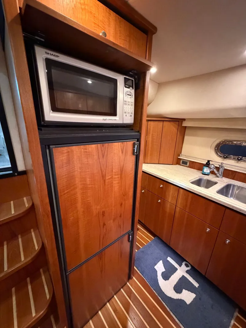 Slide: The Image of 2009 Tiara Yachts 4300 Sovran helm with navigation systems. - 46