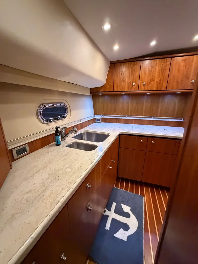 Slide: The Image of Interior of 2009 Tiara Yachts 4300 Sovran with seating area and table. - 48