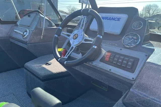 Slide: The Image of 2023 Ranger VS1782SC Reata boat dashboard with steering wheel and control panel. - 12