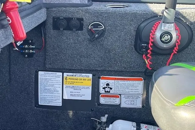 Slide: The Image of 2023 Ranger VS1782SC Reata boat interior with safety labels and controls. - 14