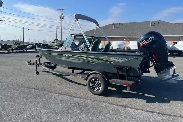 Slide: The Image of 2023 Ranger VS1782SC Reata boat on trailer, parked outdoors under clear sky. - 16