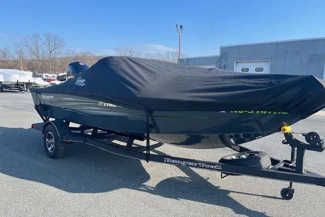 Slide: The Image of 2023 Ranger VS1782SC Reata boat with cover on trailer, parked outdoors. - 17