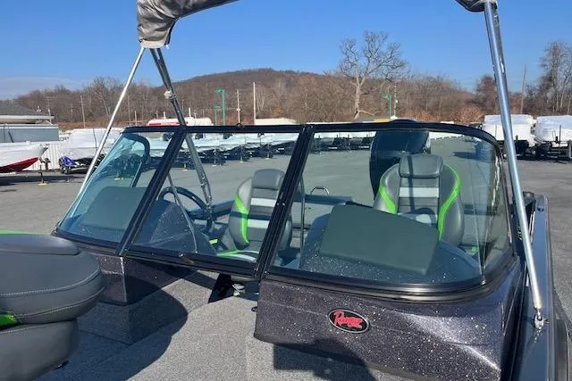 Slide: The Image of 2023 Ranger VS1782SC Reata boat with windshield and seating, parked outdoors. - 7