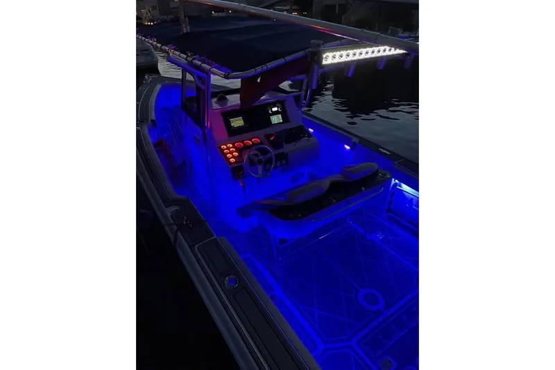 Slide: The Image of Dashboard of a 2001 Donzi 35 ZF boat with navigation and control instruments. - 10