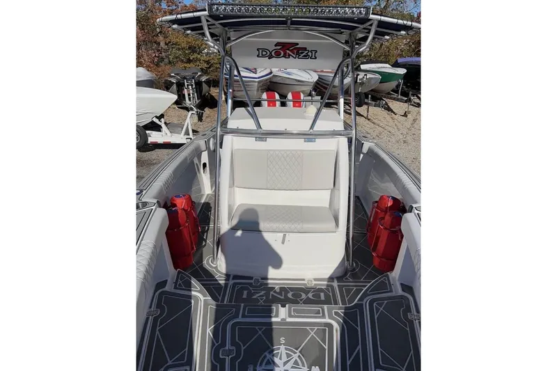 Slide: The Image of 2001 Donzi 35 ZF boat interior with steering wheel and navigation equipment. - 4