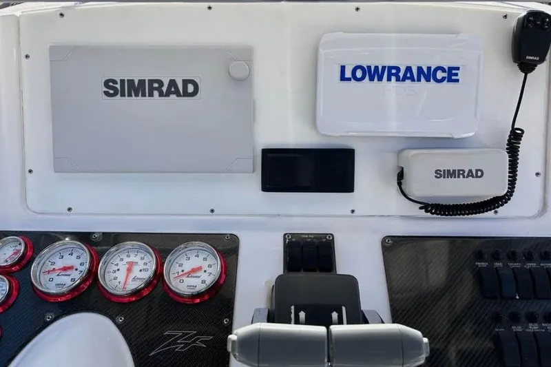 Slide: The Image of 2001 Donzi 35 ZF boat interior with seating and custom flooring design. - 5