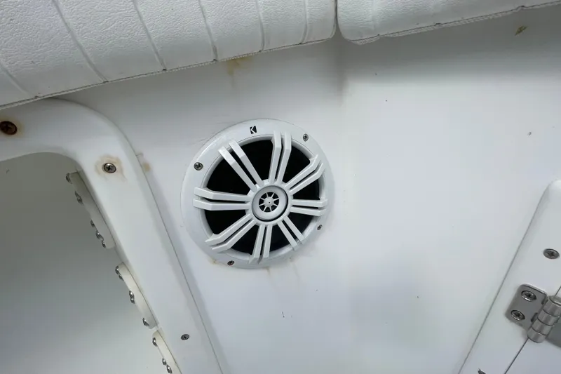 Slide: The Image of White speaker on 1999 Contender 23 Open boat interior. - 21