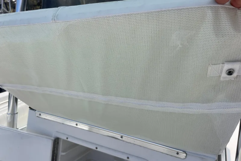 Slide: The Image of White fabric detail on a 1999 Contender 23 Open boat. - 27