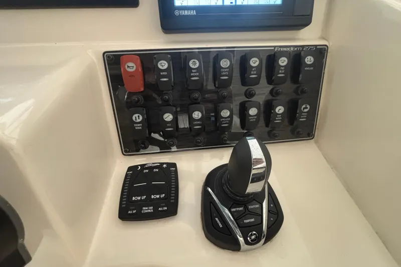 Slide: The Image of Control panel of a 2022 Grady-White Freedom 275 boat with Yamaha joystick. - 10