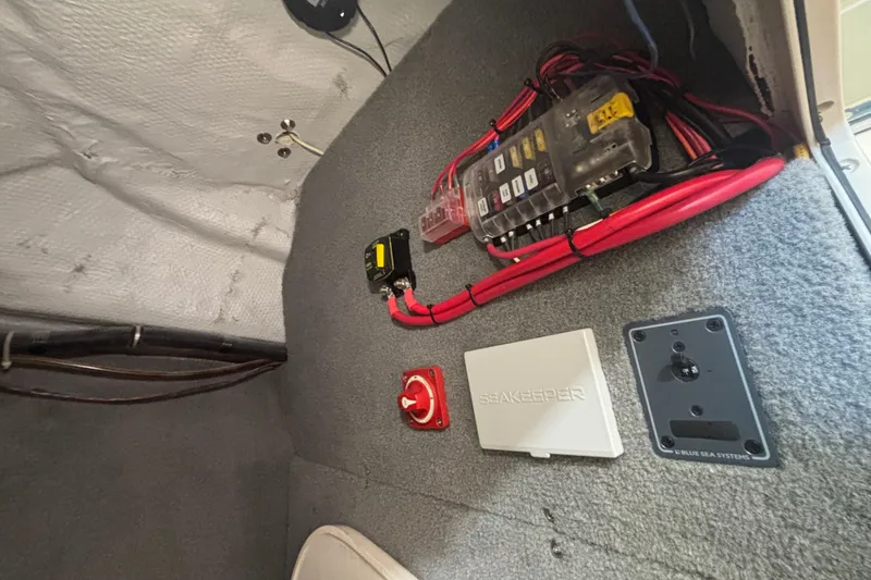 Slide: The Image of Electrical panel and wiring inside a 2022 Grady-White Freedom 275 boat. - 22