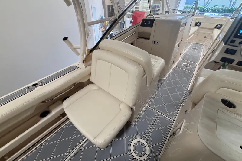 Slide: The Image of 2022 Grady-White Freedom 275 boat interior with luxurious seating and modern design. - 23